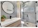 Modern bathroom features a glass-enclosed shower and sleek black fixtures at 5285 Far Oak Cir, Sarasota, FL 34238