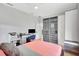 Bright bedroom features a modern desk, closet and minimalist decor, with natural light at 5285 Far Oak Cir, Sarasota, FL 34238