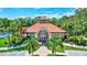 Community clubhouse showcasing lush landscaping and a inviting entrance to welcome residents and guests at 5285 Far Oak Cir, Sarasota, FL 34238
