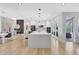 Spacious kitchen with an island, modern appliances, and access to the dining area at 5285 Far Oak Cir, Sarasota, FL 34238