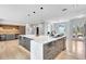 Bright kitchen with island featuring modern cabinets and finishes and stainless steel sink at 5285 Far Oak Cir, Sarasota, FL 34238