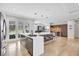 Bright kitchen features a large island with seating and stainless steel appliances at 5285 Far Oak Cir, Sarasota, FL 34238