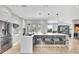 Sleek kitchen with a large island, modern appliances, and ample counter space overlooking the Gathering room at 5285 Far Oak Cir, Sarasota, FL 34238