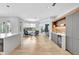 Open-concept space with built-in cabinets and bar area at 5285 Far Oak Cir, Sarasota, FL 34238