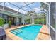 Backyard pool and patio area featuring a screened enclosure and plenty of space to relax at 5285 Far Oak Cir, Sarasota, FL 34238