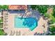 An overhead view of a sparkling pool with surrounding lounge chairs and brick pavers at 5285 Far Oak Cir, Sarasota, FL 34238