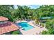 Community pool area offers a refreshing retreat with ample seating and mature landscaping at 5285 Far Oak Cir, Sarasota, FL 34238