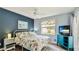 Comfortable bedroom with a ceiling fan, bright window and plenty of sunlight at 5307 Kenvil Dr, North Port, FL 34288