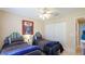 Charming bedroom featuring two twin beds, ceiling fan, and closet at 5307 Kenvil Dr, North Port, FL 34288