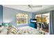 Comfortable bedroom with a ceiling fan, bright window and plenty of sunlight at 5307 Kenvil Dr, North Port, FL 34288
