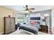 Bedroom with a ceiling fan, a modern bed frame, and access to the backyard at 5307 Kenvil Dr, North Port, FL 34288