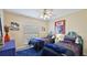 Cozy bedroom features two beds, a ceiling fan, and plenty of natural light at 5307 Kenvil Dr, North Port, FL 34288