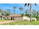 Charming single-story home featuring well-manicured lawn and clean neutral paint at 5307 Kenvil Dr, North Port, FL 34288