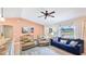 Bright and airy living room featuring comfortable seating, large windows, and stylish decor at 5307 Kenvil Dr, North Port, FL 34288