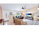 Bright, open living room featuring tile floors, vaulted ceilings, and plenty of natural light at 5307 Kenvil Dr, North Port, FL 34288