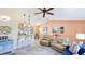 Open-concept living room flowing into the kitchen, featuring modern decor and comfortable seating at 5307 Kenvil Dr, North Port, FL 34288