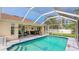 Inviting screened-in pool with covered patio and well-maintained deck at 5307 Kenvil Dr, North Port, FL 34288