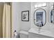 Clean bathroom featuring a modern vanity, toilet, mirror and tiled shower at 5412 Skyline Pl, Sarasota, FL 34232