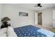 Bedroom with bed, ceiling fan, lamp, carpet, and plenty of natural light from the windows at 5412 Skyline Pl, Sarasota, FL 34232