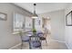 Inviting dining area with a window view, modern light fixture and seating for four at 5412 Skyline Pl, Sarasota, FL 34232