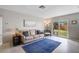 Cozy living area with neutral colors, plush seating, and access to the outdoors at 5412 Skyline Pl, Sarasota, FL 34232
