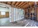 Renovation project showcasing a room's exposed structure, concrete block walls, and tile flooring at 5705 23Rd W St, Bradenton, FL 34207