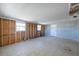 Bright living room with tile flooring, exposed wall studs, and a white front door, ready for customization at 5705 23Rd W St, Bradenton, FL 34207