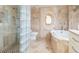 Bathroom featuring a glass-enclosed shower, soaking tub, and custom tile design at 5880 Midnight Pass Rd # 207, Sarasota, FL 34242