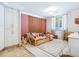 ' bedroom features a play area, a bright rug, and an abundance of natural light at 5880 Midnight Pass Rd # 207, Sarasota, FL 34242