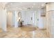 Bright foyer with tile floors, recessed lighting, round area rug, and neutral walls at 5880 Midnight Pass Rd # 207, Sarasota, FL 34242