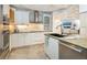 Well-equipped kitchen with stainless steel appliances, ample counter space, and stylish finishes at 5880 Midnight Pass Rd # 207, Sarasota, FL 34242