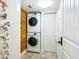 Laundry room features a stacked washer and dryer, and closet space at 5880 Midnight Pass Rd # 207, Sarasota, FL 34242