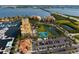 Scenic aerial shot featuring waterfront property, tennis courts, and well-manicured landscaping at 610 Riviera Dunes Way # 503, Palmetto, FL 34221