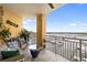 Spacious balcony with seating and stunning views of the marina at 610 Riviera Dunes Way # 503, Palmetto, FL 34221