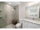 Modern bathroom featuring a glass walk-in shower and vanity with marble countertops and sleek finishes at 610 Riviera Dunes Way # 503, Palmetto, FL 34221