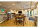 Community dining area with a kitchenette and lots of seating with a large tv at 610 Riviera Dunes Way # 503, Palmetto, FL 34221