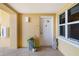 Inviting entryway with decorative accents, a potted plant, and textured walls at 610 Riviera Dunes Way # 503, Palmetto, FL 34221