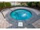 Picture of a luxurious hot tub with brick surroundings and a calming ambiance at 610 Riviera Dunes Way # 503, Palmetto, FL 34221