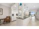 Bright kitchen featuring white cabinets, stainless steel appliances, and a marble island overlooking a view at 610 Riviera Dunes Way # 503, Palmetto, FL 34221