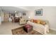 Comfortable living area with stylish decor, open floor plan and adjacent dining space at 610 Riviera Dunes Way # 503, Palmetto, FL 34221