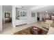Spacious living area with TV, decorative furnishings, and open access to kitchen and dining at 610 Riviera Dunes Way # 503, Palmetto, FL 34221