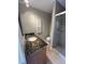 Bathroom with a granite countertop, a glass enclosed shower and tile flooring at 6300 Flotilla Dr # 108, Holmes Beach, FL 34217