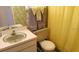 Functional bathroom with a vanity sink, toilet, and shower, showcasing a practical layout at 6300 Flotilla Dr # 108, Holmes Beach, FL 34217