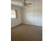 Bright bedroom with a ceiling fan and natural light from the window, creating a cozy space at 6300 Flotilla Dr # 108, Holmes Beach, FL 34217