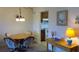 Quaint dining area with view into the kitchen at 6300 Flotilla Dr # 108, Holmes Beach, FL 34217