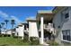Low rise condominiums featuring stairwells and well-kept landscaping at 6300 Flotilla Dr # 108, Holmes Beach, FL 34217