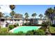 Community complex featuring lush landscaping and a small outdoor area at 6300 Flotilla Dr # 108, Holmes Beach, FL 34217