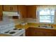 Cozy kitchen featuring bright countertops, and white appliances at 6300 Flotilla Dr # 108, Holmes Beach, FL 34217