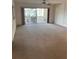 Large living room featuring sliding glass doors that lead to a screened in patio at 6300 Flotilla Dr # 108, Holmes Beach, FL 34217
