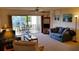 Well-lit living room with sliding doors to the balcony at 6300 Flotilla Dr # 108, Holmes Beach, FL 34217